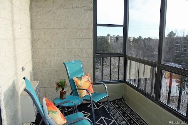 sunroom / solarium featuring a healthy amount of sunlight