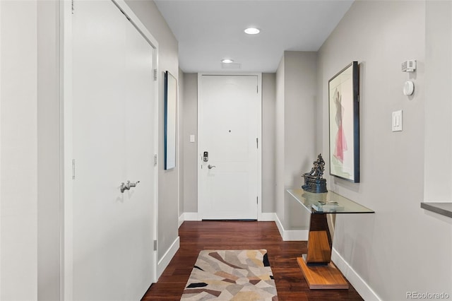 doorway to outside featuring recessed lighting, baseboards, and wood finished floors