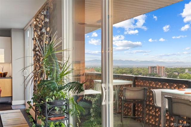 balcony featuring a mountain view and a view of city