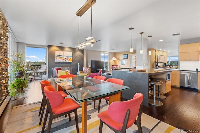 dining space featuring recessed lighting, visible vents, plenty of natural light, and dark wood-style floors