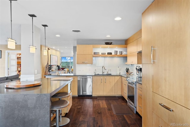 kitchen featuring visible vents, light brown cabinets, appliances with stainless steel finishes, dark wood-style floors, and a sink