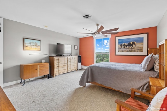 bedroom with visible vents, baseboards, ceiling fan, carpet flooring, and baseboard heating