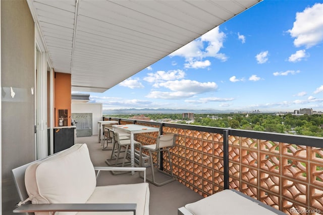 balcony featuring an outdoor living space and a view of city