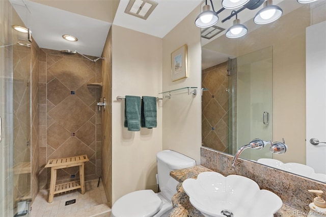 full bathroom featuring toilet and a stall shower