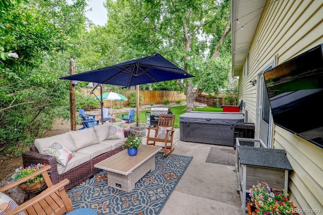 8217 Club Crest Dr, Arvada, CO 80005 - fenced backyard featuring a hot tub, a patio area, outdoor lounge area, and a grill