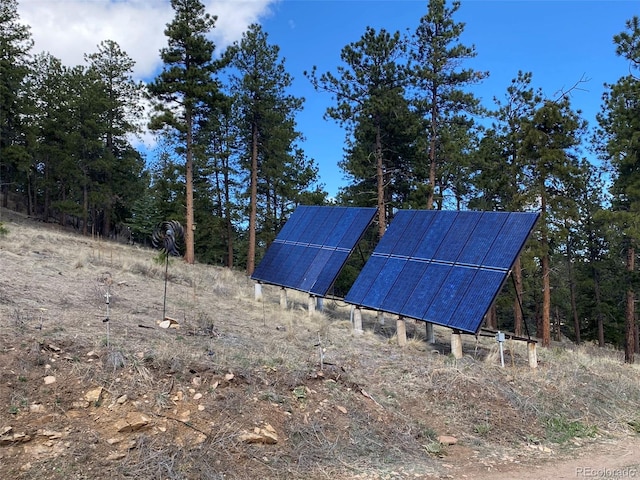 view of property exterior with solar panels