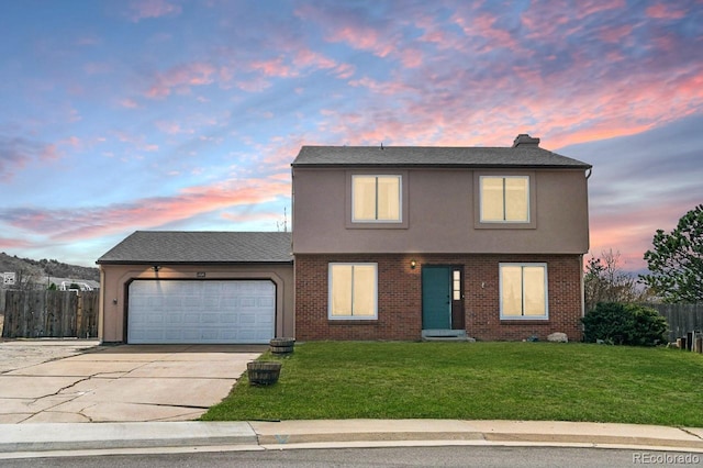 1206 Baldwin Park Cir, Castle Rock, CO 80104 - traditional-style house featuring concrete driveway, a garage, stucco siding, and brick siding