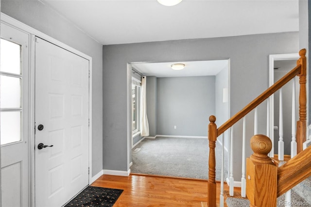1206 Baldwin Park Cir, Castle Rock, CO 80104 - entryway with light wood-style floors, baseboards, and stairway