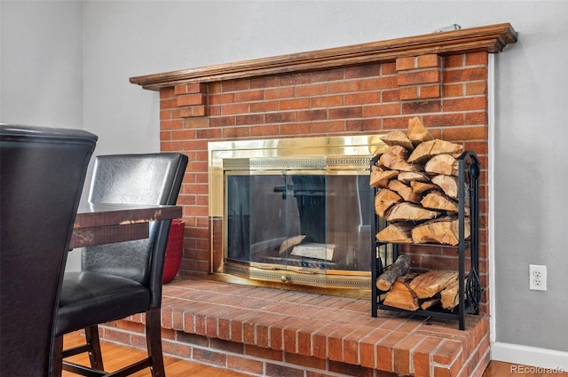 1206 Baldwin Park Cir, Castle Rock, CO 80104 - detailed view of a fireplace, wood finished floors, and baseboards
