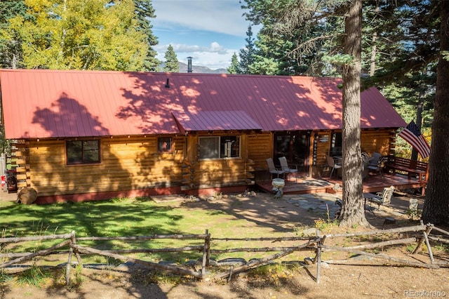 4745 Forest Ln, Howard, CO 81233 - log-style house with a deck, log exterior, and metal roof