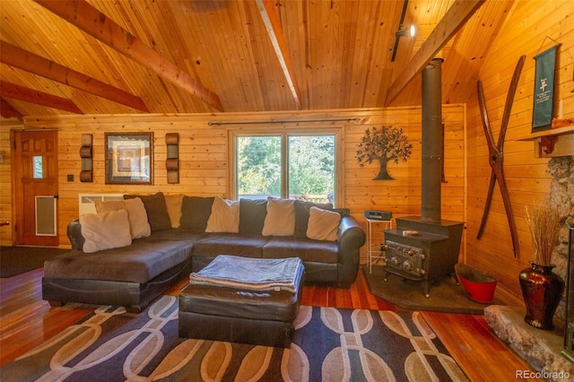4745 Forest Ln, Howard, CO 81233 - living room featuring wooden ceiling, wood walls, a wood stove, and wood finished floors