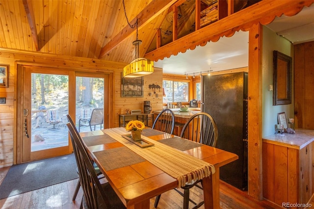 4745 Forest Ln, Howard, CO 81233 - dining room featuring wood walls, hardwood / wood-style flooring, plenty of natural light, and wood ceiling