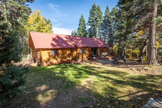 4745 Forest Ln, Howard, CO 81233 - view of front of property featuring log siding, a front yard, and metal roof