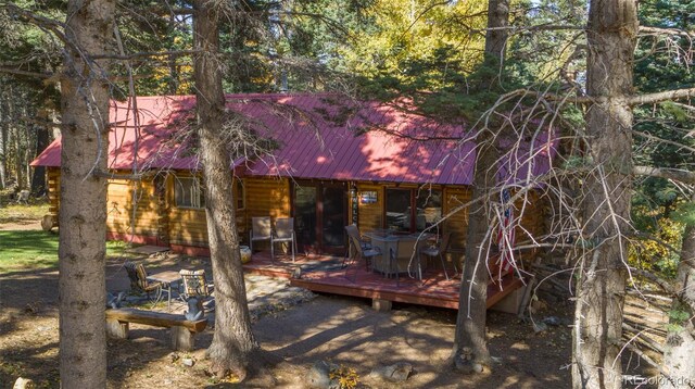 4745 Forest Ln, Howard, CO 81233 - rear view of property with a wooden deck and metal roof