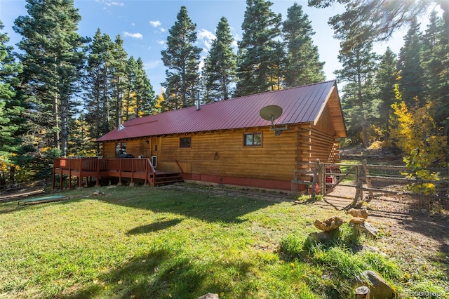 4745 Forest Ln, Howard, CO 81233 - back of house with a deck, log exterior, metal roof, and a gate