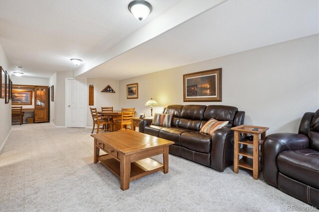 living room with light colored carpet and baseboards