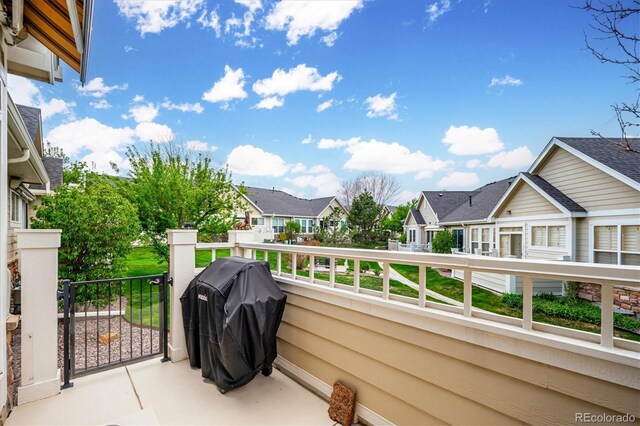 balcony with grilling area and a residential view