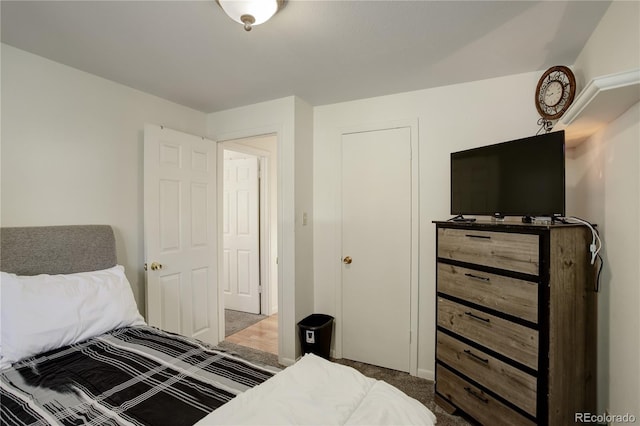 bedroom with dark colored carpet