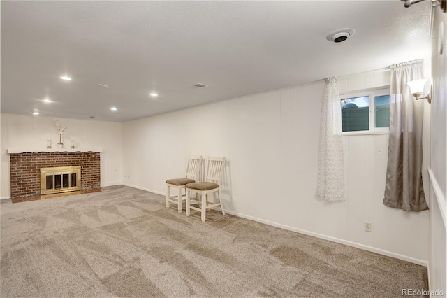 basement featuring a fireplace and carpet floors