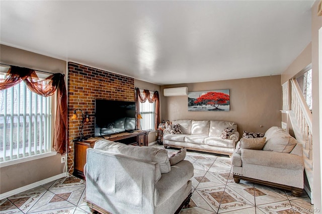 living room featuring an AC wall unit and a healthy amount of sunlight