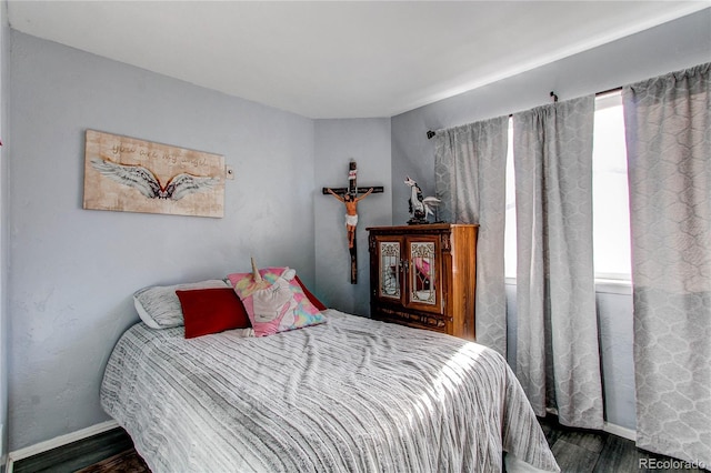 bedroom featuring dark hardwood / wood-style flooring