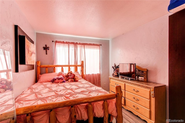 bedroom featuring a textured ceiling