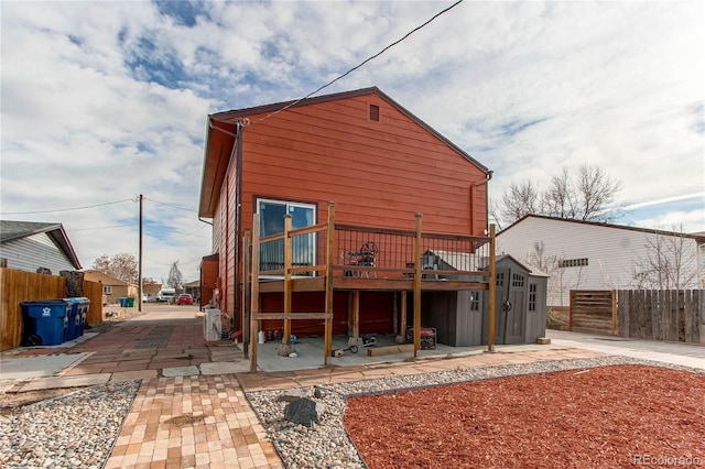 back of property with a wooden deck