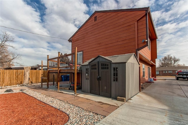 exterior space featuring a shed and a deck