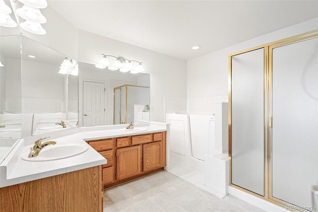 bathroom featuring shower with separate bathtub and vanity