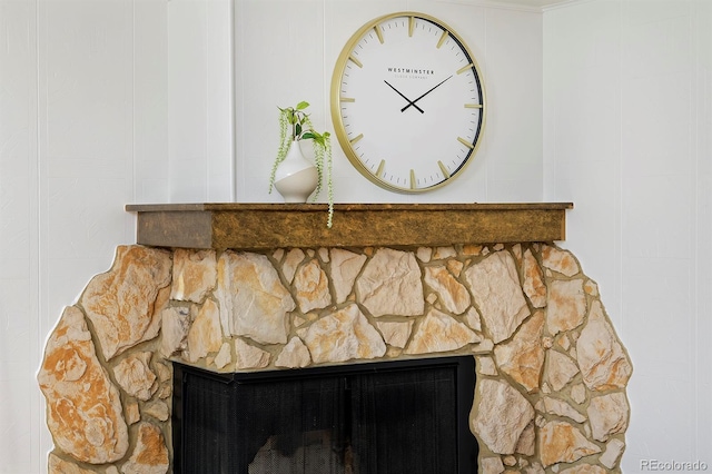 interior details with a stone fireplace