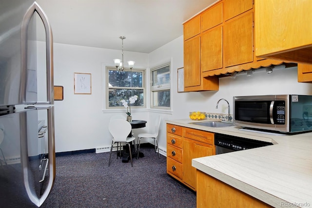 kitchen with stainless steel appliances, a chandelier, and sink