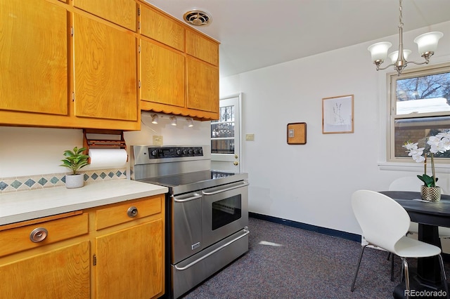 kitchen with double oven range, decorative light fixtures, and a notable chandelier