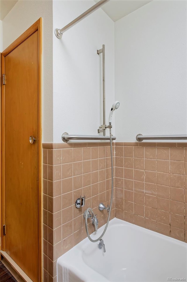 bathroom with a tub to relax in