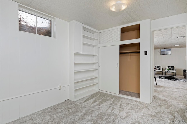 interior space featuring light colored carpet