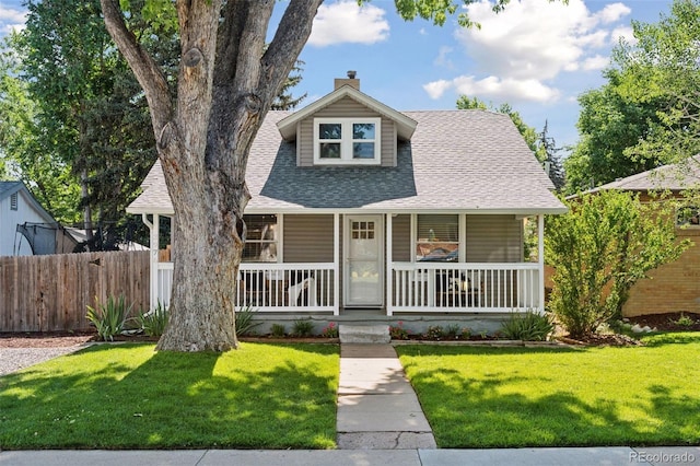 3976 S Washington St, Englewood, CO 80113 - bungalow featuring roof with shingles, covered porch, and a chimney
