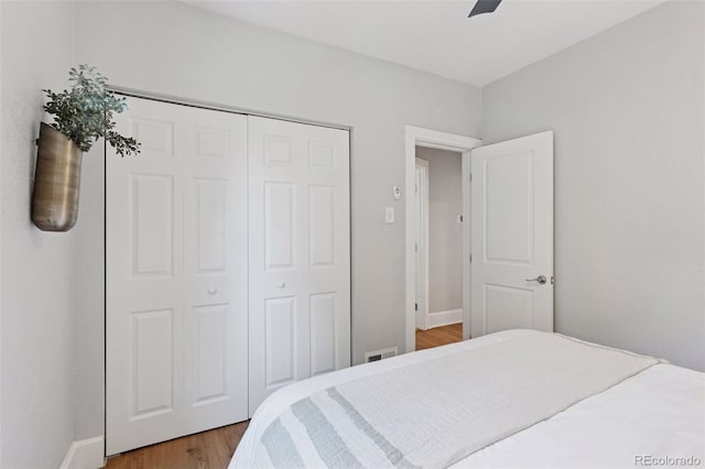 3976 S Washington St, Englewood, CO 80113 - bedroom featuring light wood-type flooring, a closet, and a ceiling fan