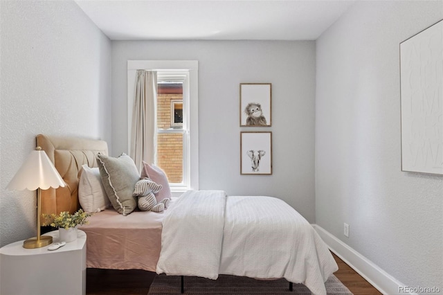 3976 S Washington St, Englewood, CO 80113 - bedroom featuring wood finished floors and baseboards