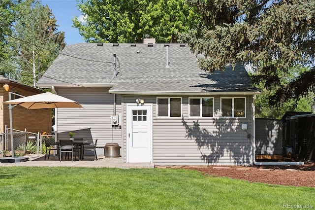 3976 S Washington St, Englewood, CO 80113 - back of property with a patio, a shingled roof, and a chimney