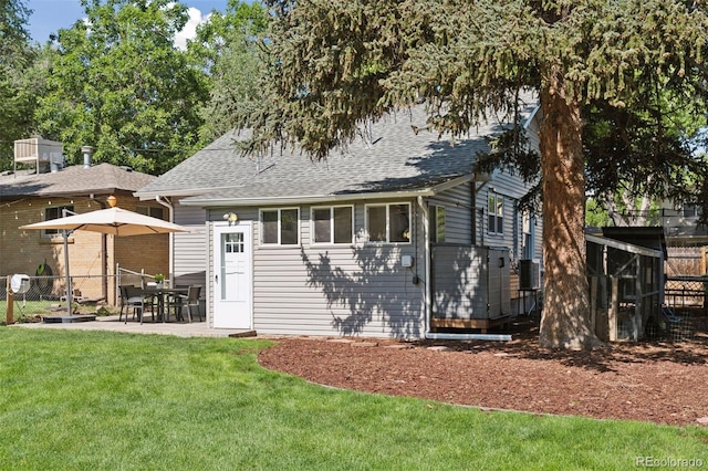 3976 S Washington St, Englewood, CO 80113 - back of property with roof with shingles and a patio