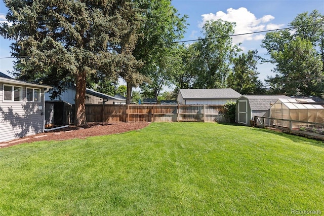 3976 S Washington St, Englewood, CO 80113 - fenced backyard with an exterior structure and a shed