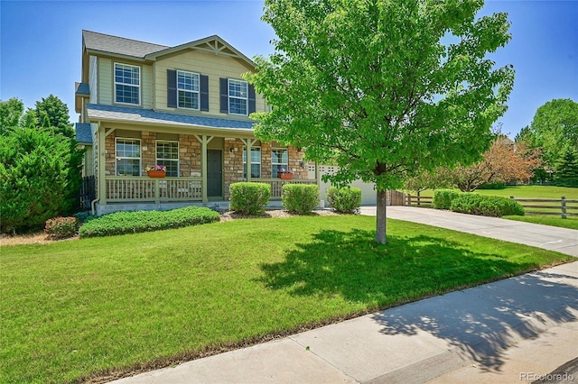 6910 E 131st Dr, Thornton, CO 80602 - view of front of property featuring driveway, a porch, stone siding, and a garage