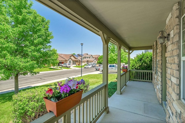 6910 E 131st Dr, Thornton, CO 80602 - porch featuring a residential view