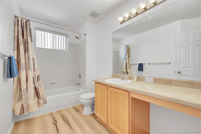 6910 E 131st Dr, Thornton, CO 80602 - bathroom with wood finished floors, vanity, and shower / bath combo