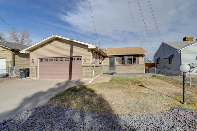 view of front of house featuring a front yard and a garage