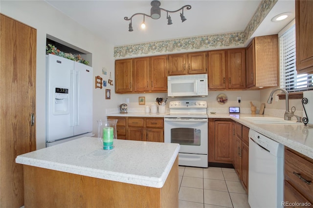 kitchen featuring a center island, light tile patterned flooring, white appliances, and sink