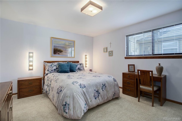 bedroom with light colored carpet