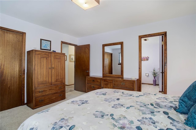 bedroom featuring light carpet