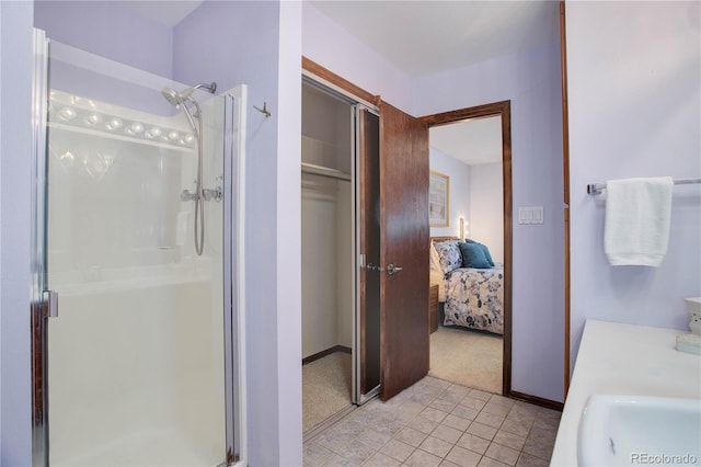 bathroom featuring vanity and a shower with shower door