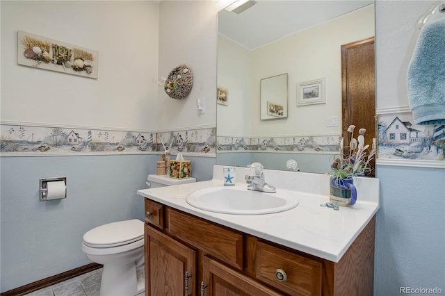 bathroom featuring tile patterned floors, vanity, and toilet