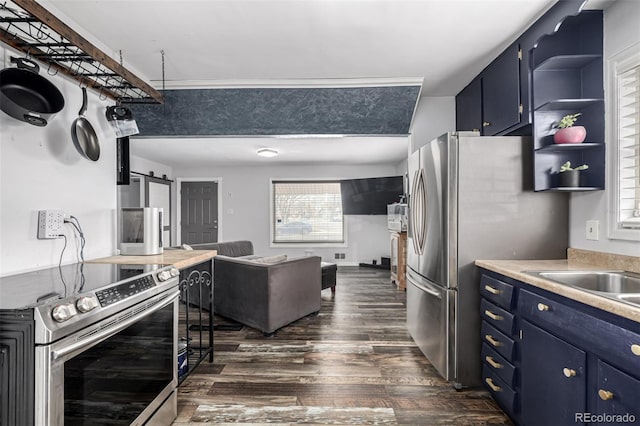 kitchen featuring blue cabinets, stainless steel appliances, open shelves, and a barn door